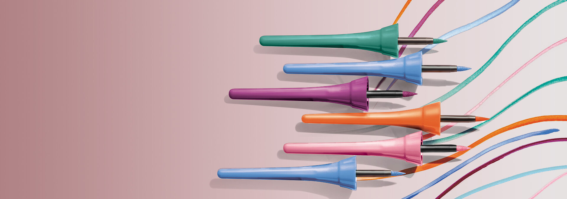 Banner com fundo rosa claro, apresentando delineadores coloridos em embalagens vibrantes (verde, azul, laranja, roxo e rosa). O texto sugere precisão e intensidade para maquiagens incríveis.