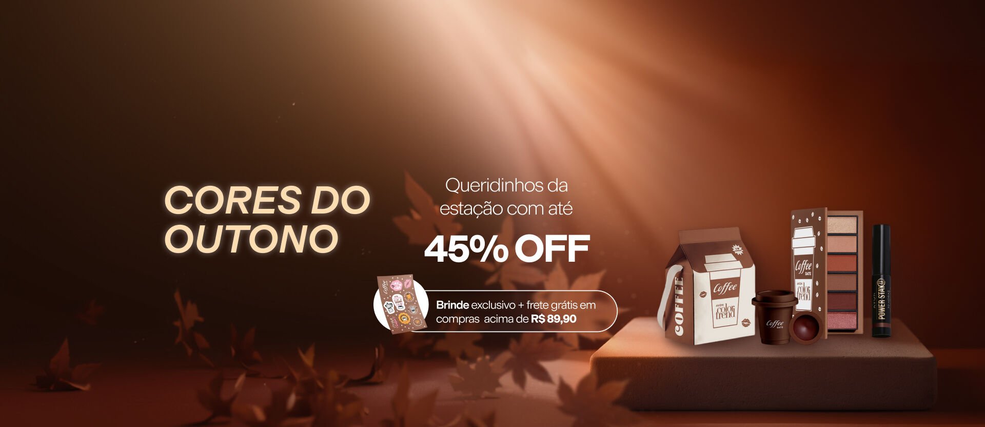 Itens Color Trend Coffee Date, com texto: "Cores do outono. Queridinhos da estação com até 45% OFF". "Brinde exclusivo + frete grátis em compras acima de R$ 89,90" em box. Fundo marrom iluminado com folhas secas.