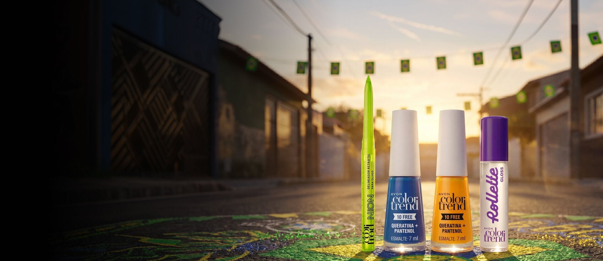 Produtos Color Trend enfileirados no asfalto de uma rua residencial decorada para a Copa do Mundo. O chão está pintado com as cores verde, amarela e azul, e bandeirinhas cruzam o céu ao fundo.