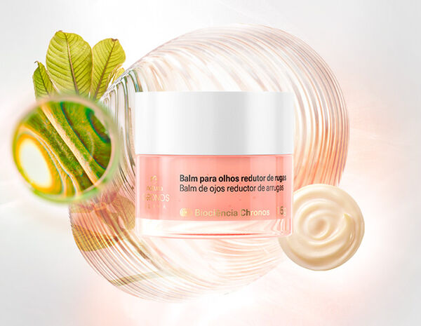 Natura Chronos Derma Balm para Olhos Redutor de Rugas, com frasco rosê e tampa branca, em destaque sobre poderosos ativos da fórmula em fundo branco. Ao lado, selo "aprovado por dermatologistas".