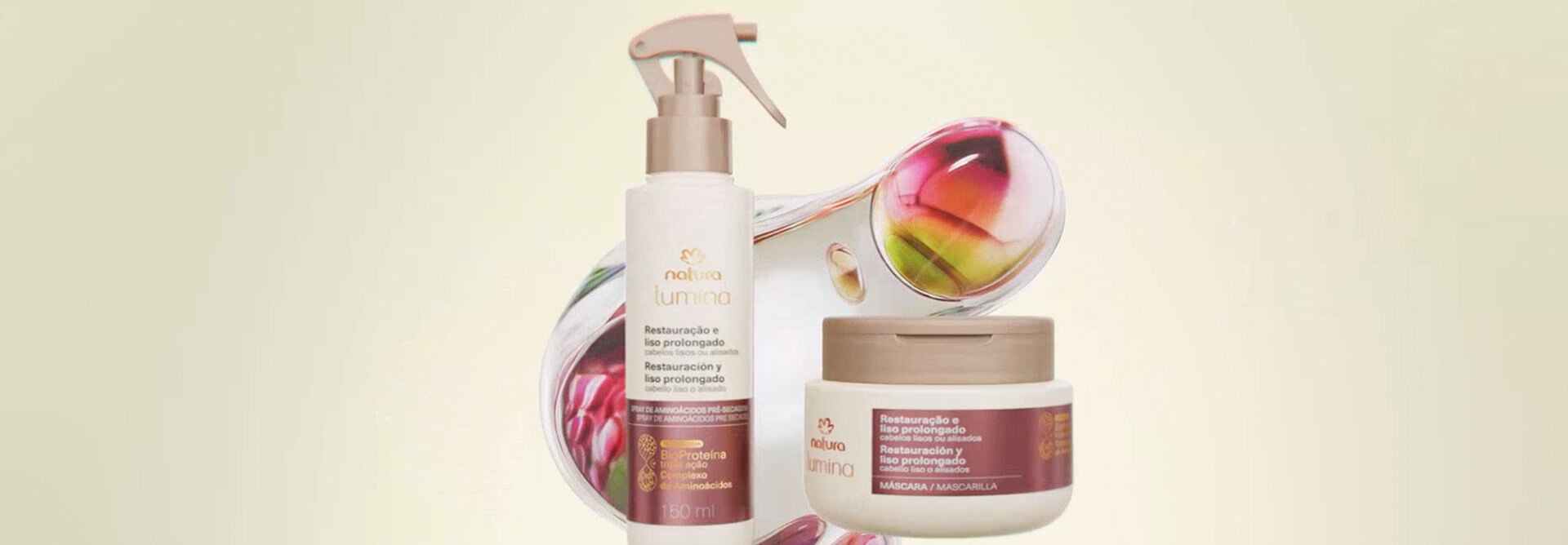 Produtos da linha Natura Lumina com elementos orgânicos, seguido de imagens de mulher de cabelos longos e lisos, com detalhes da textura capilar. Vídeo finaliza com a linha completa Natura Lumina, em fundo creme.