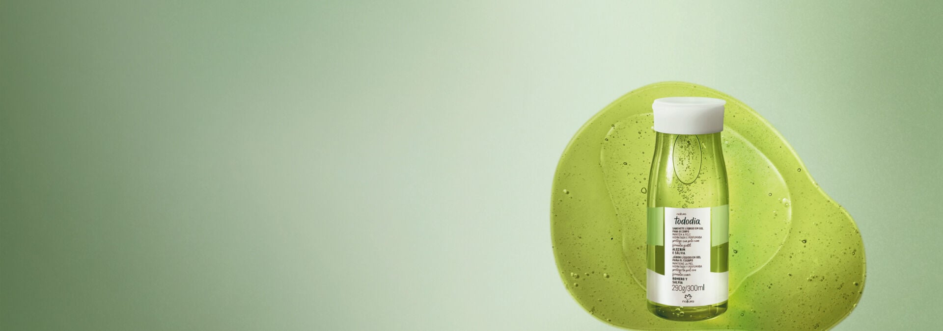 Fundo em tons de verde e ao lado direito um frasco de sabonete líquido Natura Tododia Alecrim e Sálvia