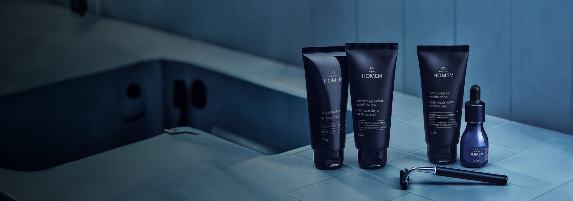 Fundo com tons de Azul claro e escuro, ao lado direito produtos para barba.