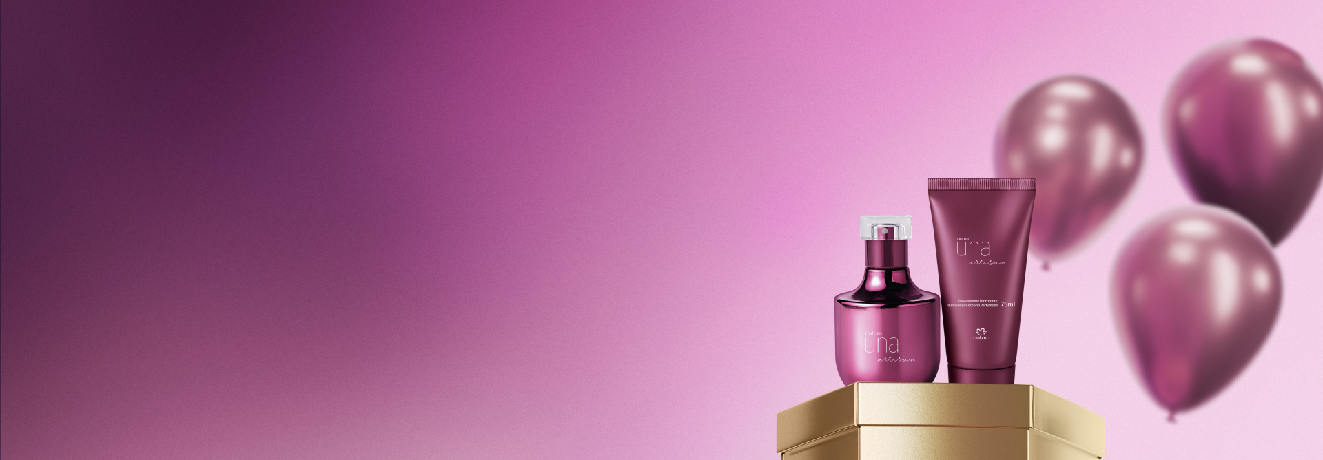 Presente Natura Una Artisan, com Deo Parfum e Hidratante Iluminador para o Corpo, com frasco e bisnaga violetas, destaca-se sobre caixa hexagonal dourada. Atrás, balões violetas sobre fundo rosado.