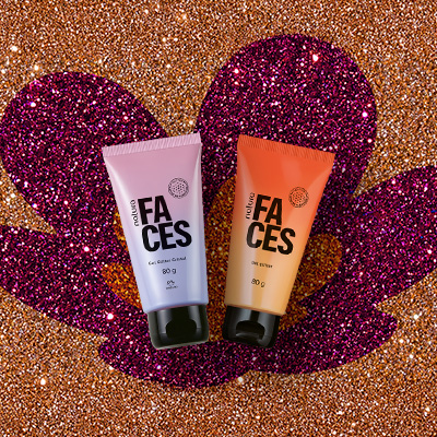 Duas bisnagas de Gel Glitter Faces, uma degradê rosa e outra laranja, ambas com tampas pretas. Estão sobre fundo em glitter laranja com a flor símbolo da Natura aplicada em glitter laranja e rosa.