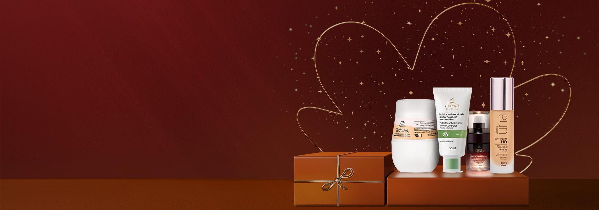 Desodorante Roll-on Tododia, Protetor FPS 30 Chronos, Sérum Chronos e Base Líquida Una sobre caixas marrom com fita dourada. Fundo vinho com flor símbolo da Natura e pontos de luz dourados.