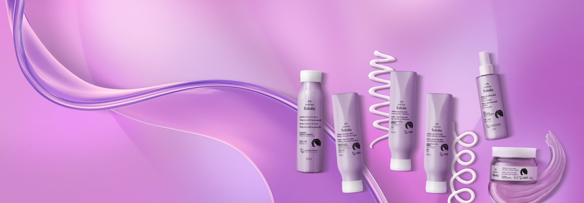 Produtos Natura Tododia Cabelos sobre espumas brancas, com bolhas de sabão, em fundo rosa.