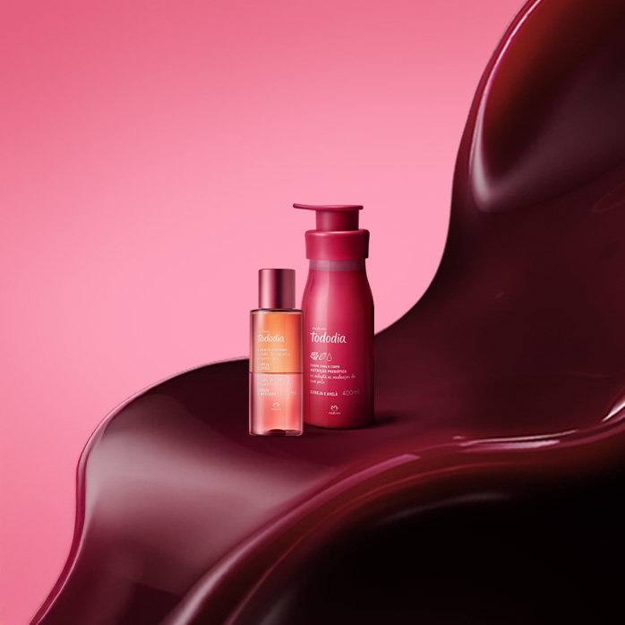 Produtos Natura Tododia Cereja e Avelã sobre formas orgânicas na cor vermelha, em fundo rosa.