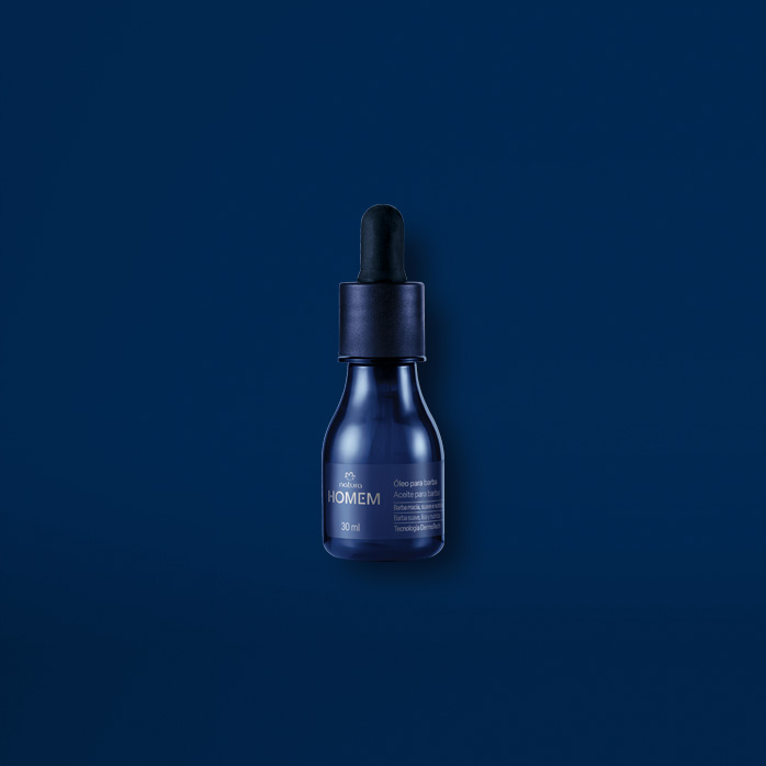 Óleo para Barba Natura Homem sobre fundo azul escuro.