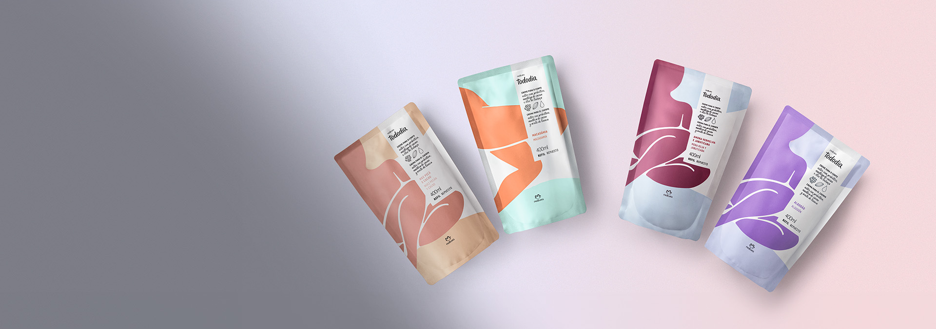 Quatro refis de creme hidratante para o corpo da linha Tododia, sobre um fundo degradê suave em tons de cinza e rosa claro.
