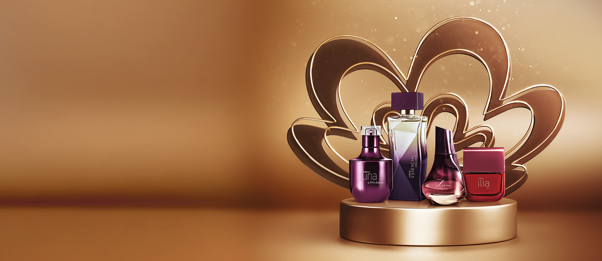 Natura Una Artisan, Essencial Exclusivo, Luna Intenso e Ilía Ser aparecem em destaque sobre plataforma, rosácea símbolo da Natura e fundo em tons de dourado e bronze com brilhos.