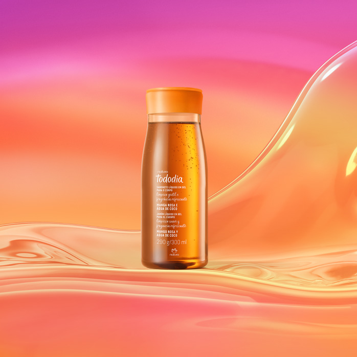 Frasco laranja de Sabonete Líquido Tododia Manga Rosa e Água de Coco sobre grafismo e fundo em laranja com rosa.