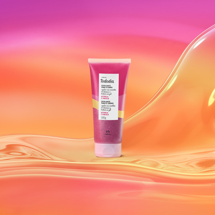 Bisnaga rosa de Esfoliante para o Corpo Tododia Acerola e Hibisco sobre grafismo e fundo em laranja com rosa.