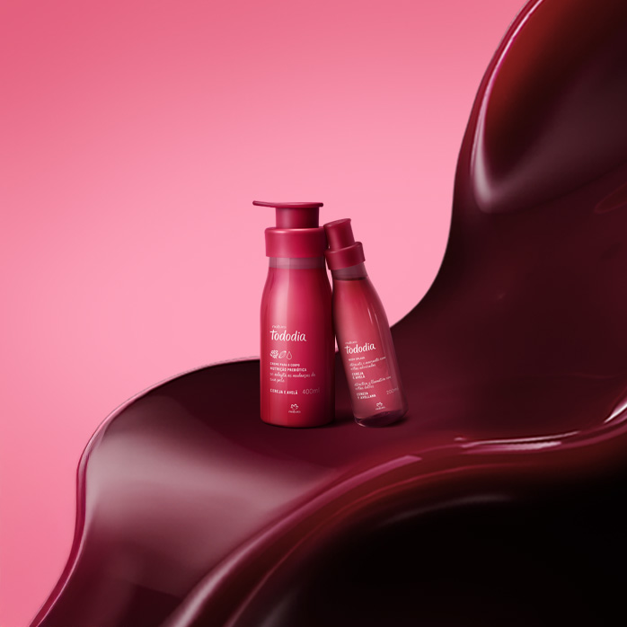 Produtos Natura Tododia Cereja e Avelã sobre formas orgânicas na cor vermelha, em fundo rosa.