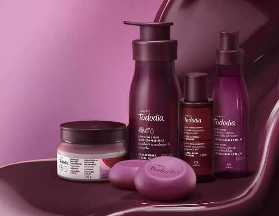 Produtos Natura Tododia sobre forma fluida na cor vinho e fundo lilás.