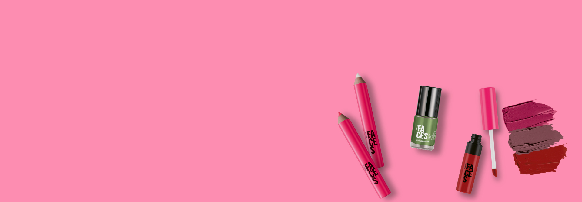 Em fundo rosa, lápis rosa nas cores pink e neon, embalagem verde de esmalte e embalagem aberta de batom líquido com texturas matte nas cores rosado, marrom e vermelho, da coleção Rolê de Natura Faces.