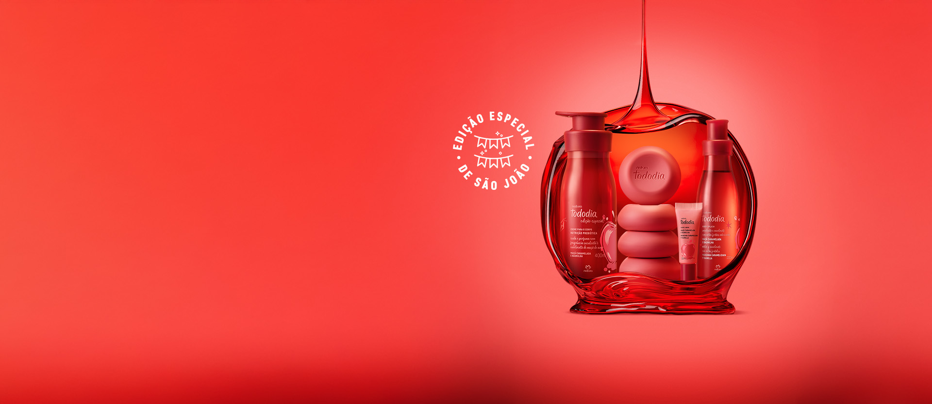 Linha Natura Tododia sobre forma vermelha em fundo com tons de vermelho e selo Edição Especial de São João