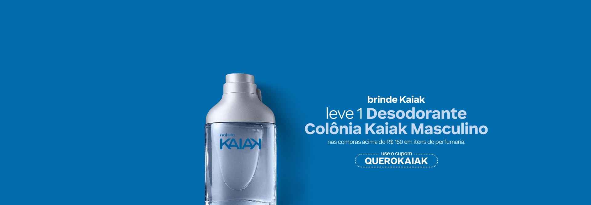 Banner com destaque para o texto: brinde Kaiak. Leve 1 Desodorante Colônia Kaiak Masculino em compras acima de R$ 150 em itens de perfumaria. Use o cupom QUEROKAIAK. Fundo azul com um frasco de Kaiak.