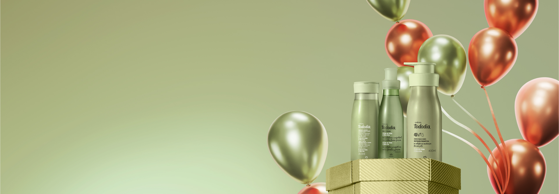 À direita, três frascos verdes da linha Tododia: Creme Hidratante, Body Splash e Sabonete Líquido, sobre caixa dourada com balões verdes e laranjas. Fundo em degradê verde.