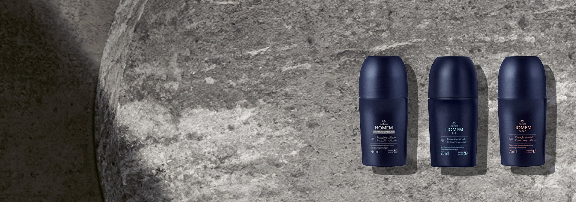 Fondo gris oscuro y, al lado derecho de la imagen, un desodorante roll-on de la línea Homem de Natura.