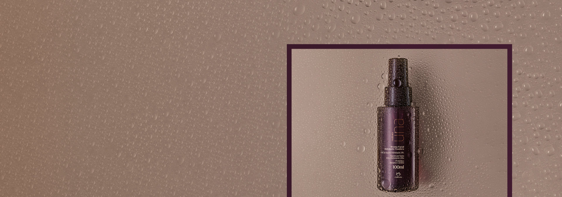 Fondo marrón con gotas de agua y a la derecha dentro de un marco, la bruma fijadora de Una