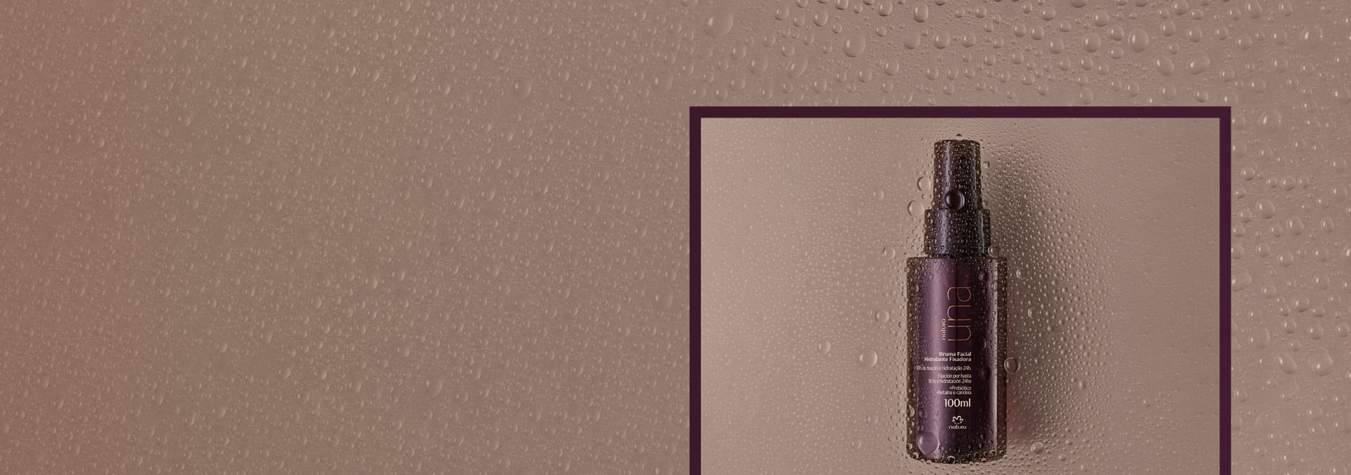  Fondo marrón con gotas de agua y a la derecha dentro de un marco, la bruma fijadora de Una