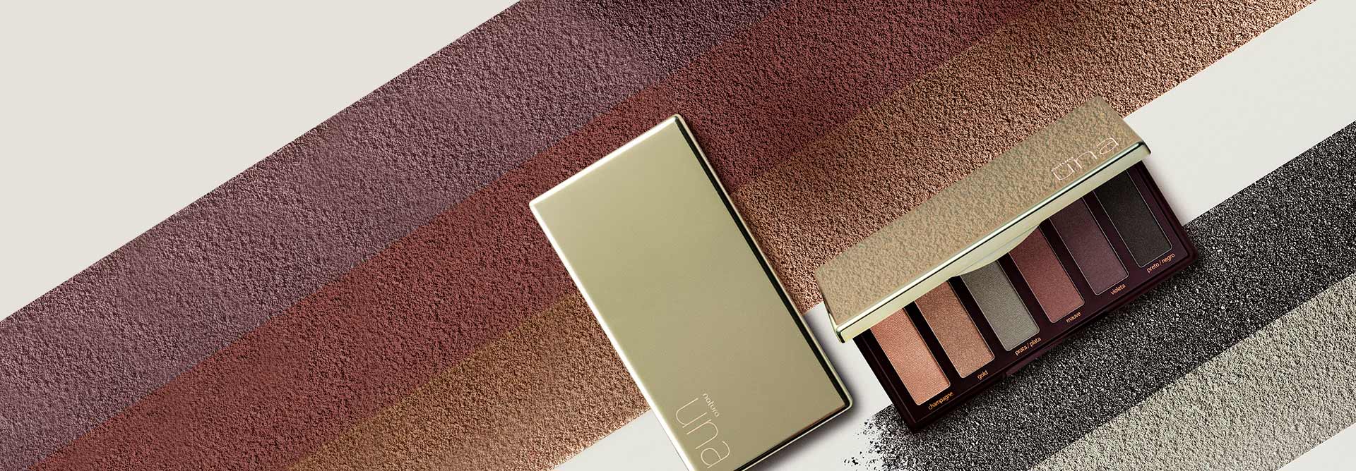 Imagen de la paleta de sombras Una con diferentes colores y texturas al fondo.