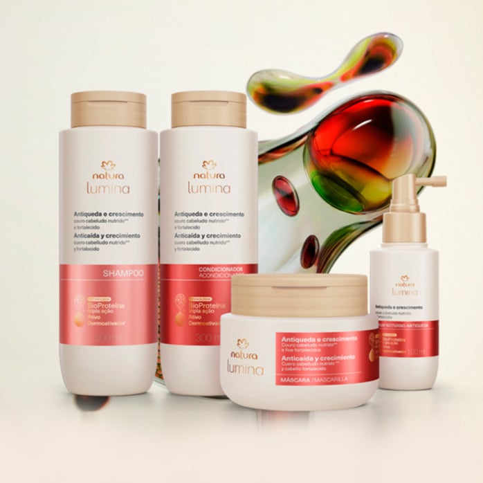 Imagen con un fondo de color beige y unas moléculas en colores rojos y verdes, con cuatro de nuestros productos de Lumina al frente